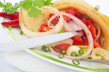 Pancake with vegetables on a plate