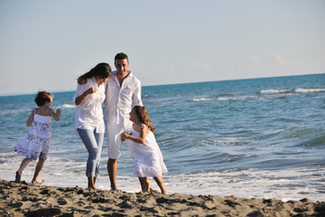 happy young  family have fun on beach