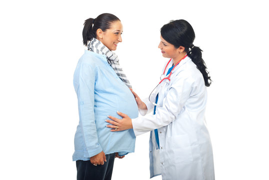 Doctor Touching Pregnant Belly