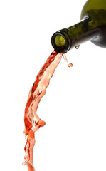 Pouring red wine, liquid falling isolated on white