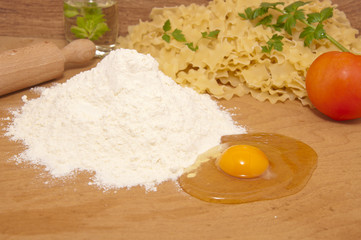 nice fresh pasta ingredients on a board to knead dough