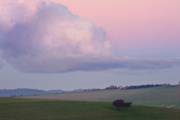 Naklejka na ściany i meble Stunning vibrant color cloud and sunrise countryside
