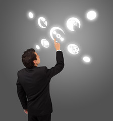 business man pressing touchscreen button