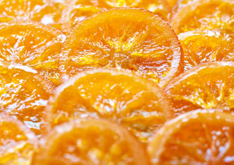 Fototapeta na wymiar Kandyzowane plastry pomarańczy