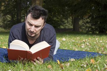 Young Adult Reading at the Park