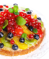 cake with fresh berries and fruit closeup