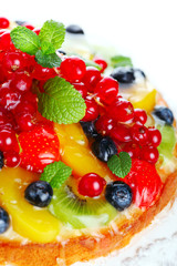 cake with fresh berries and fruit closeup