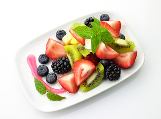 fruit salad in a white dish