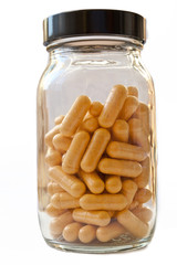 Capsules in a glass bottle