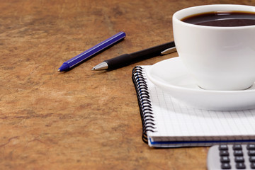 pad, pens and coffee