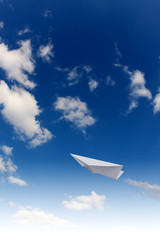 Paper planes in blue sky