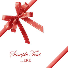 Shiny red satin ribbon on white background with copy space