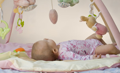 Infant on Activity Mat © Imants Ozolins
