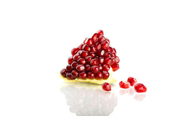 a cluster of pomegranate on white