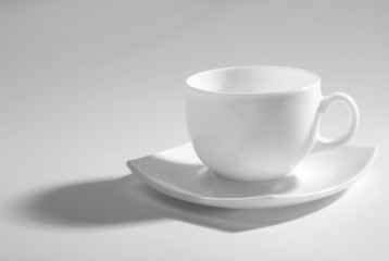 An empty coffee cup on a gray background
