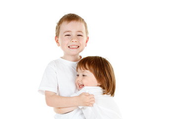 Young siblings hugging
