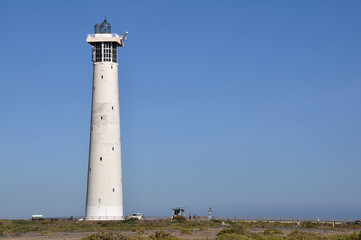 Fototapeta na wymiar Leuchtturm am Strand von Jandia