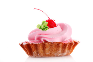 Pink cheesecake with maraschino cherry  on white