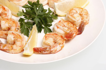 Grilled shrimp on a plate.