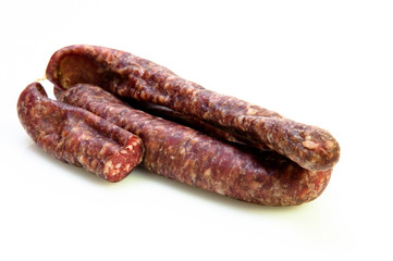 delicious fresh pork sausage cut in half on white background