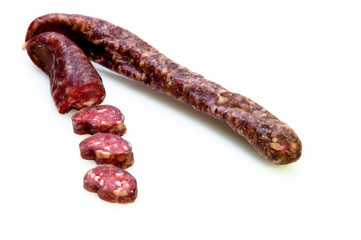 delicious fresh sausage sliced up on white background
