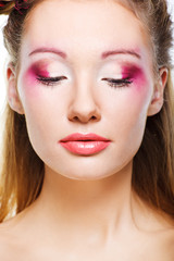 Beautiful face of a glamour woman with brightly makeup