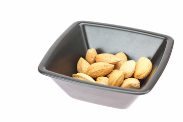 almonds in a bowl isolated on white