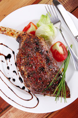 meat over wood: grlled shoulder on plate