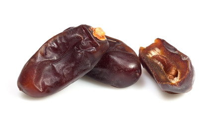 Big date dried fruit closeup on white background