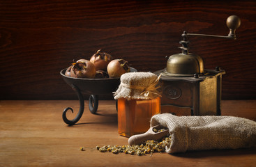 vintage still life with herbs and honey