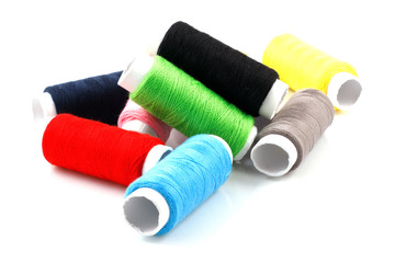 Set of colorful spools of thread isolated on white background