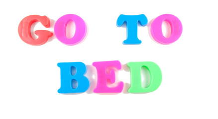 go to bed written in fridge magnets