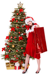 Girl in santa hat holding shopping bag, Isolated.