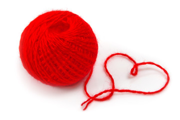 Red thread clew isolated over white background