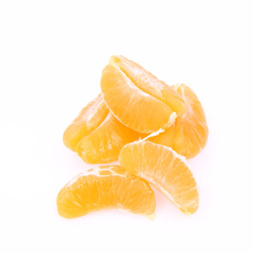 Segments of a peeled mandarin on white background