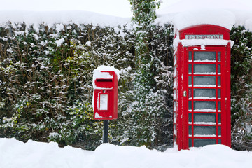 Red phonebox in the snow