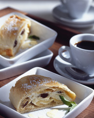 millirahmstrudel in a plate more strudel and a cup of coffee