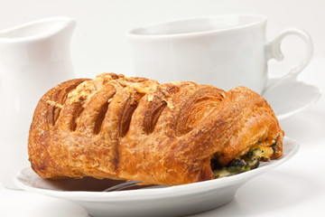 Breakfast: coffee and bun with cheese and spinach