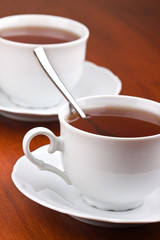 Two cups of tea with saucers