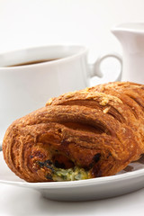 Breakfast: coffee and bun with cheese and spinach