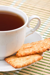 Cup of tea with crackers