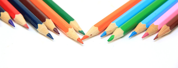 Colored pencils on white background