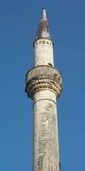 View of minaret in Ioannina city against blue sky