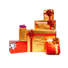Golden and red gift boxes on white background