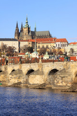 Obraz premium View on the autumn Prague gothic Castle with the Charles Bridge