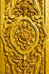 Cement sculpture of Thai art design on the temple's wall