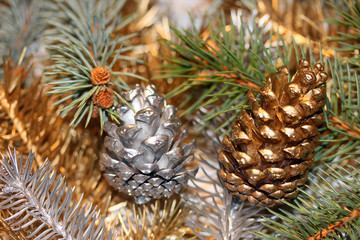 Silver and golden pine cone.