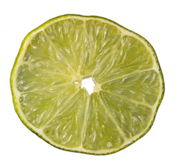 Slice of an isolated green lemon (lat. Citrus) - 