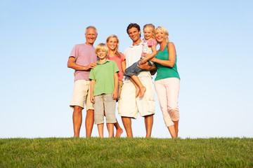 A family, with parents, children and grandparents, posing