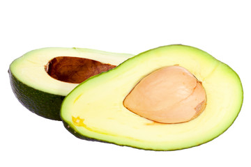 Avocado cut in half with stone isolated on white